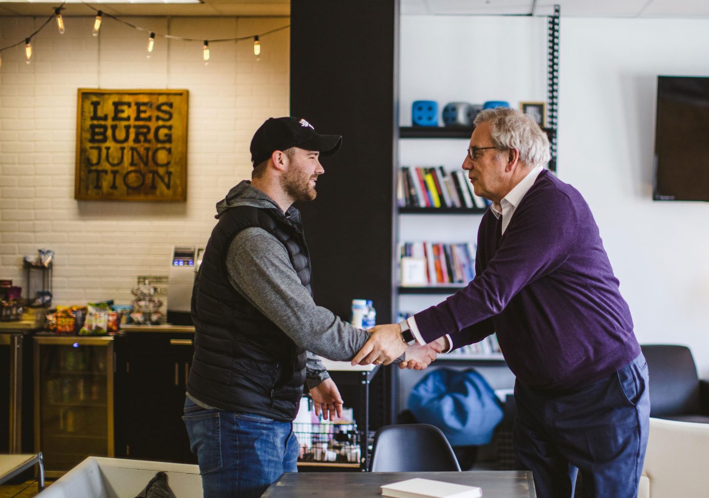 Image of Jan and Brody planning shaking hands at Inzet